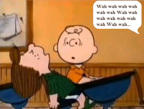 Na imagem aparecem Charlie Brown e Lucy da turma do Snoopy. Lucy dorme, Charlie Brown parece preocupado olhando para ela enquanto a professora fala o seu tradicional Wah, wah, wah sem sentido.
