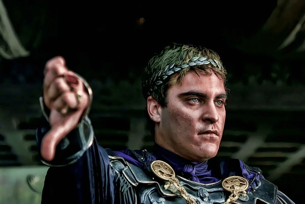 Cena do filme Gladiador (2000). Nela, o Imperador Commodus interpretado por Joaquin Phoenix decide que o perdedor da batalha deve ser morto pelo vencedor.